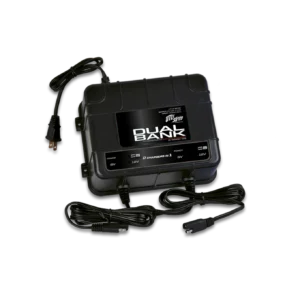 Battery charger with cables on black background.