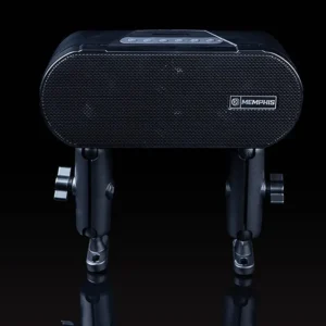 Black speaker with dual stands on black background.