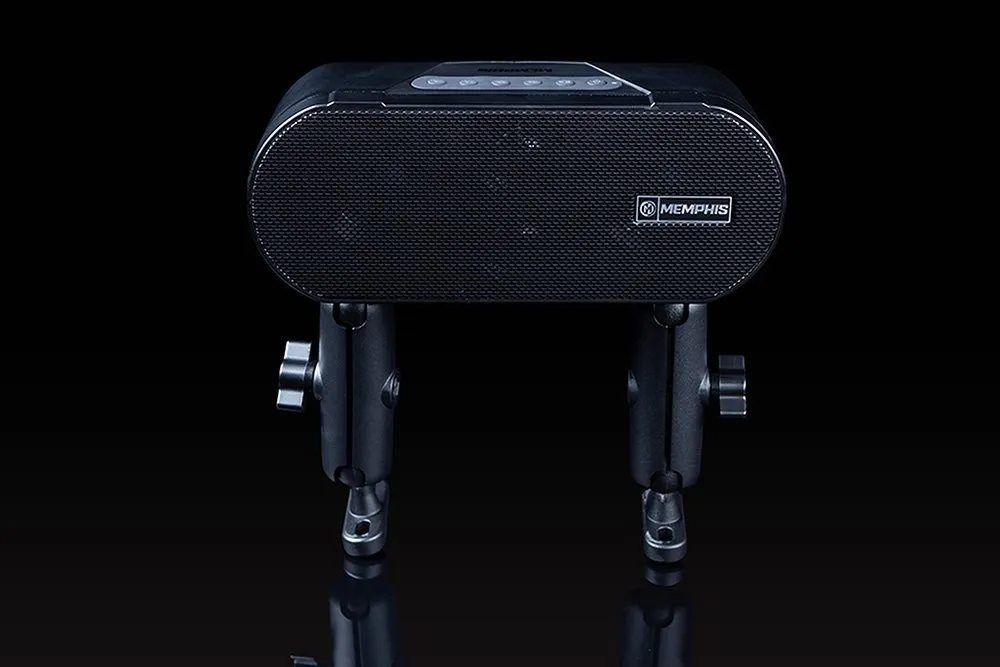 Black speaker with dual stands on black background.