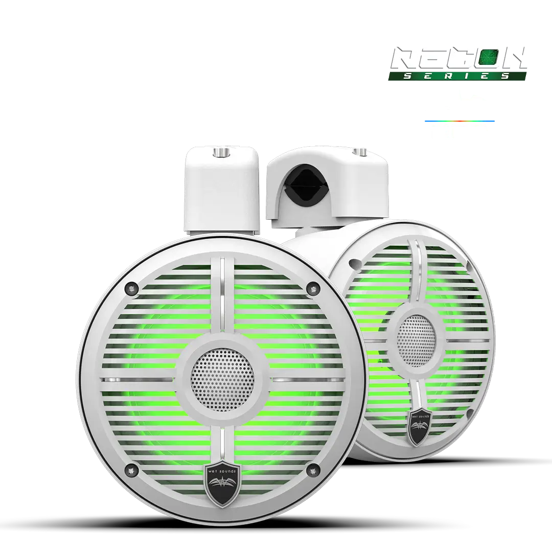 White speakers with green RGB lighting.