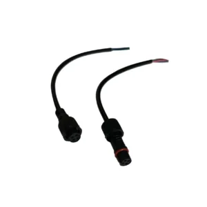 Two black electrical connectors with wires.