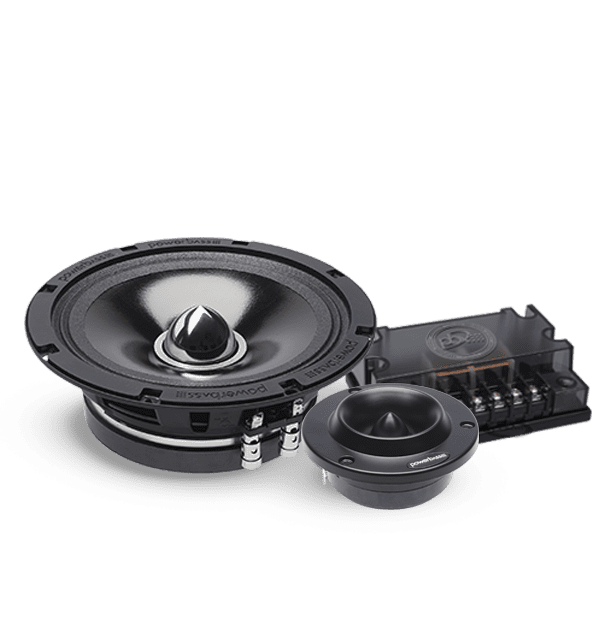Car audio speaker components on black background.
