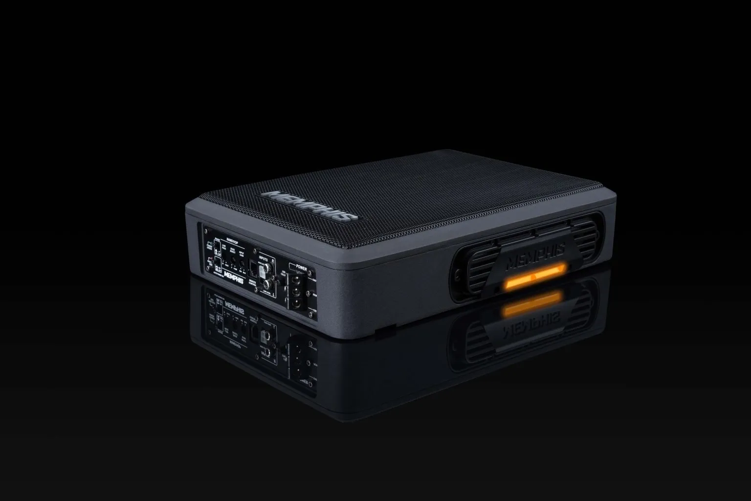 Black audio amplifier with illuminated orange light.
