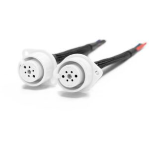 Two white electrical connectors with cables.